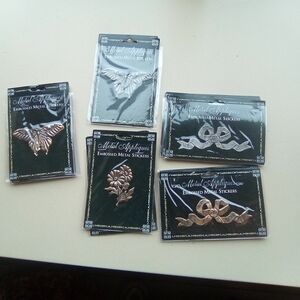 Metal embossed stickers. 15  total. NWOT.